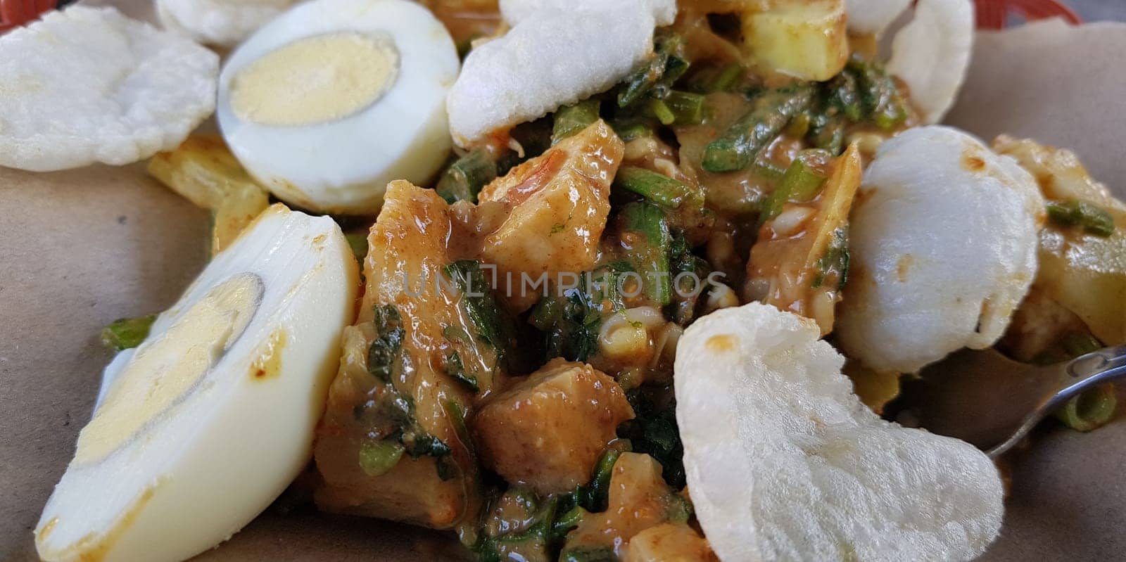 CNN winning top food, Typical Indonesian healthy food, often called gado gado, or lotek, consists of various vegetables, eggs, tempeh, and lontong with peanut sauce, street food