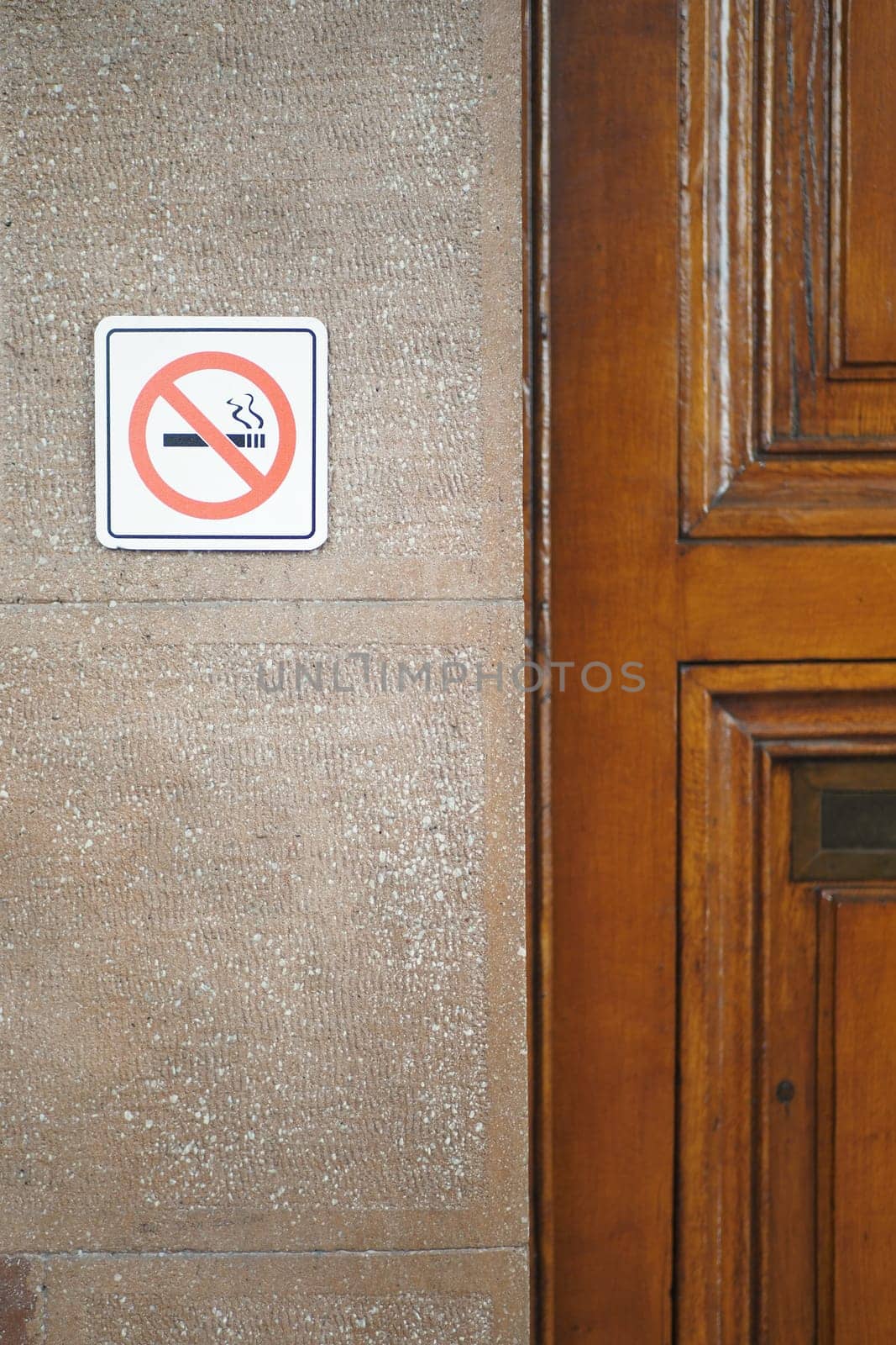 No smoke sign on a wall ,