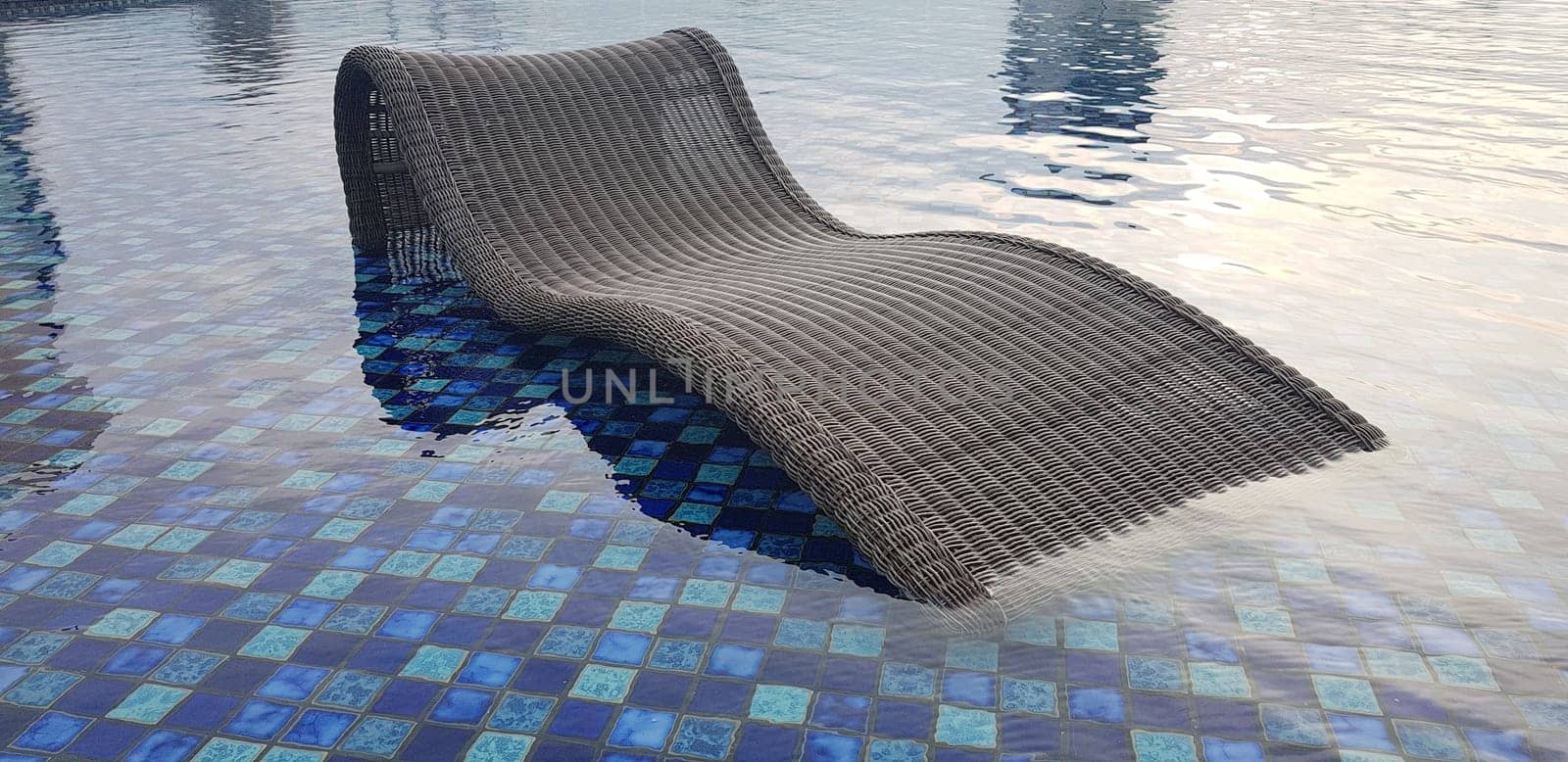 relax deck chair by the blue pool at swimming pool in luxury spa resort or villa Tourism industry crisis after covid 19 coronavirus pandemic Travel lifestyle on family summer vacation