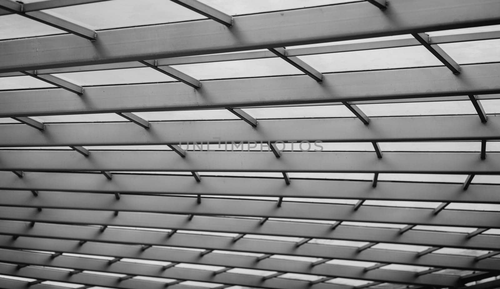 Close-up photo of technological metal grid structure. Abstract black and white image 