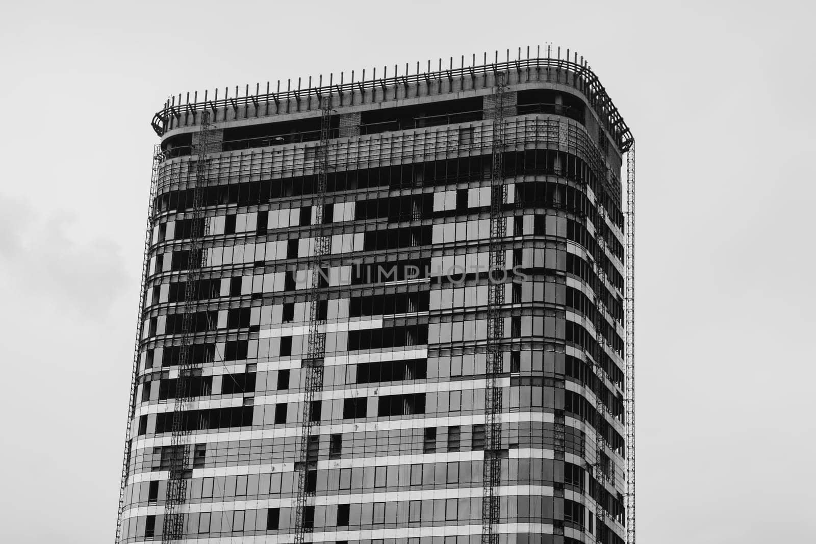 unfinished modern glass building. black and white