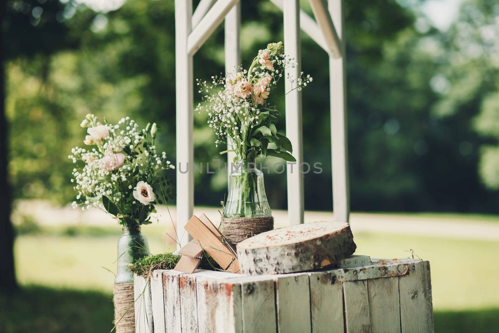 elements of wedding design. bottle with water and flowers