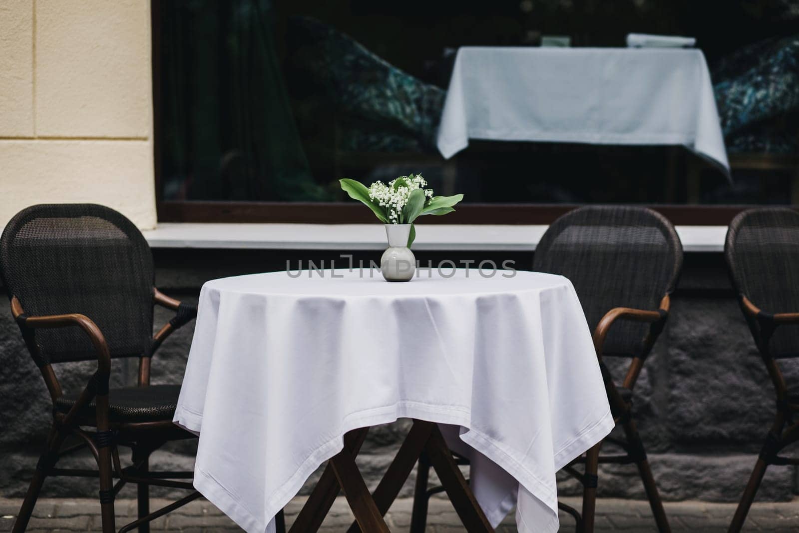 romantic place in the city. street cozy cafe with tables