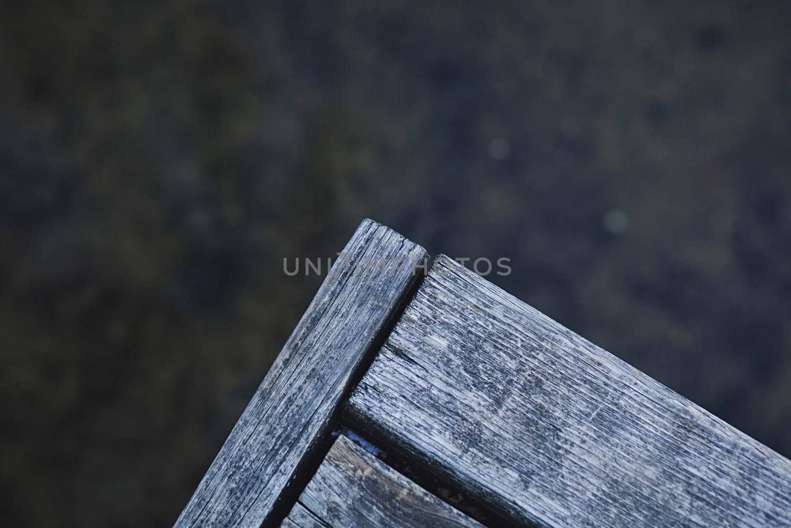 fragment of an old wooden pier on the lake