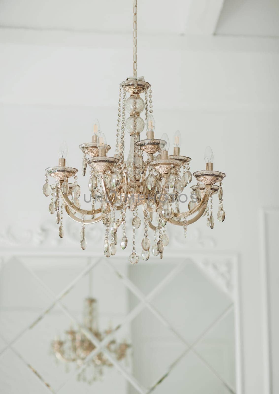 Modern crystal chandelier in classic interior