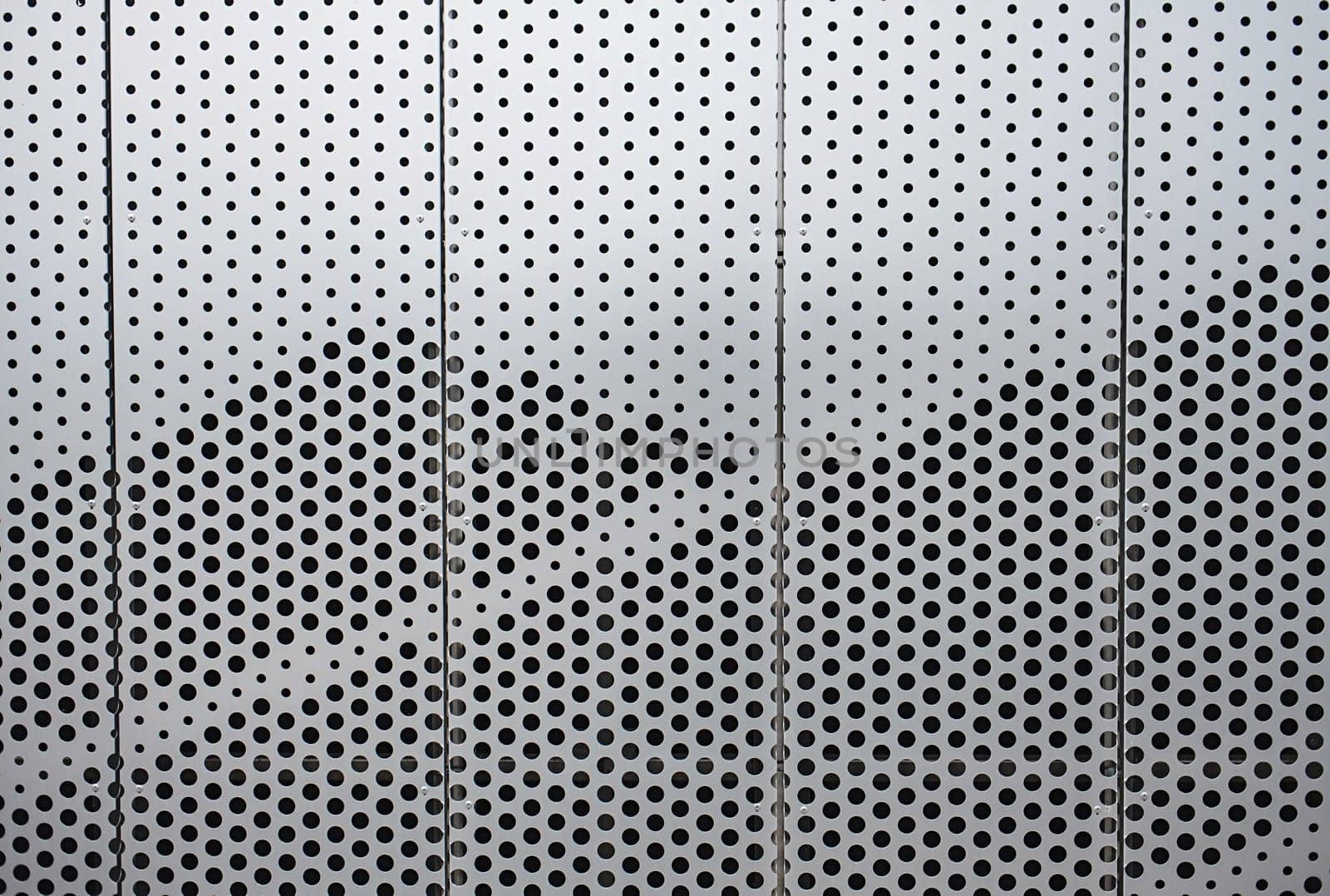 Wall of silver metal futuristic office building by Ladouski