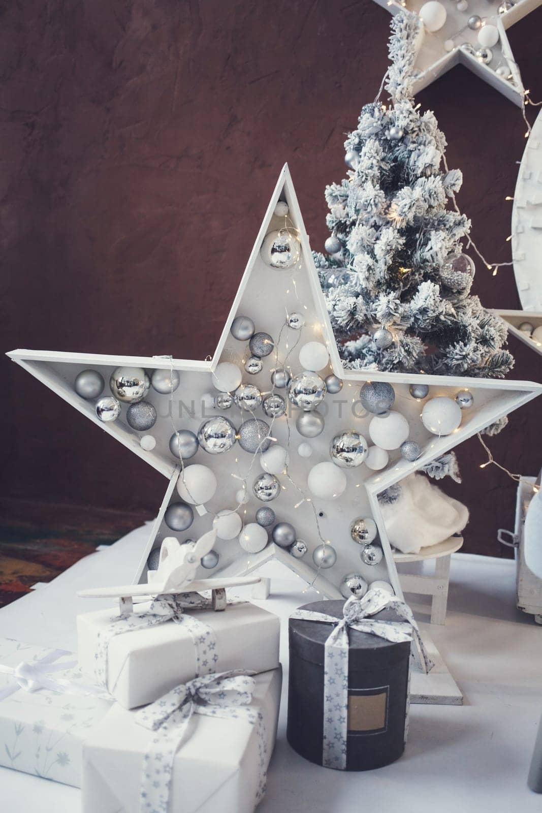 Christmas garlands with festive decoration, stars and gifts