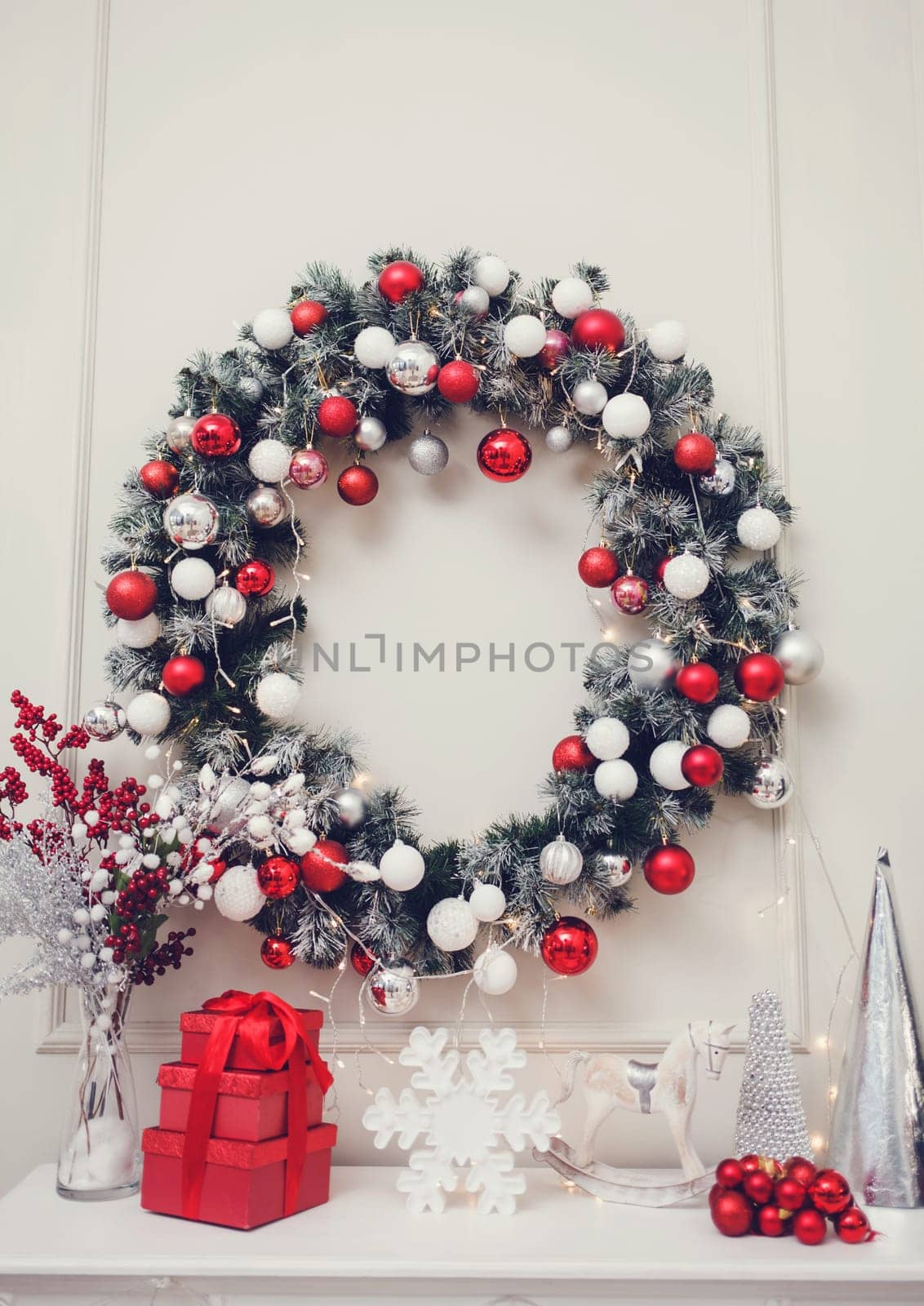New Year and Christmas 2020. Christmas apartment with a fireplace, beautiful tree with balls