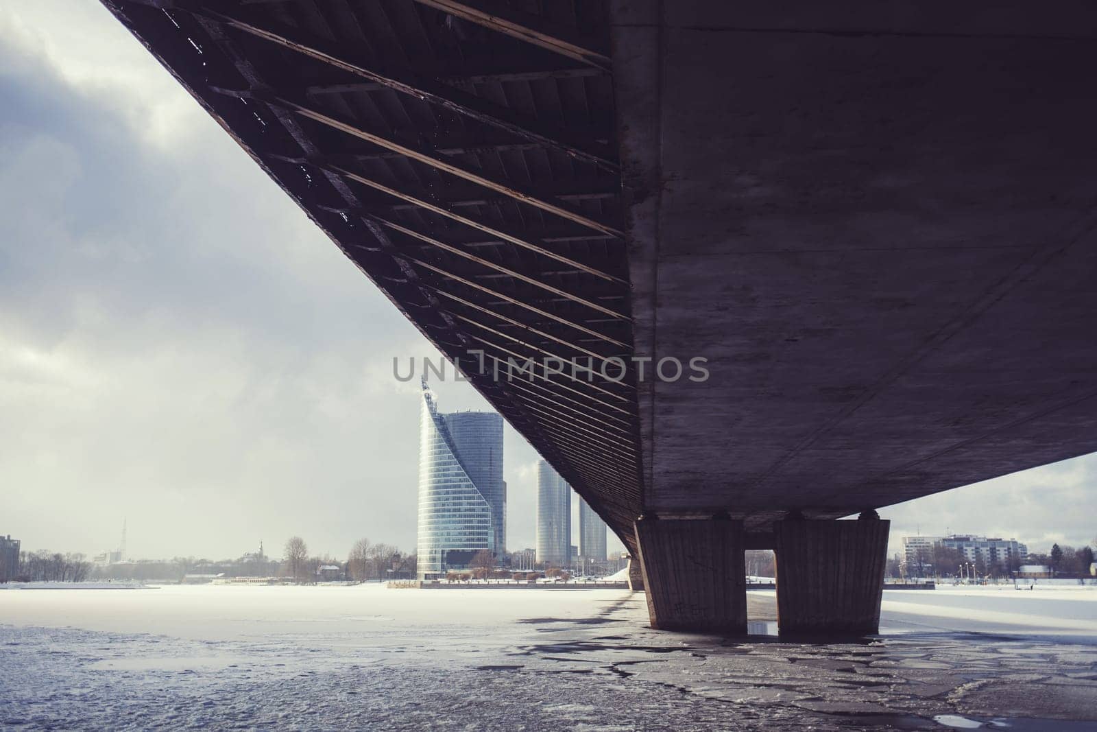 under bridge over river Daugava in winter day