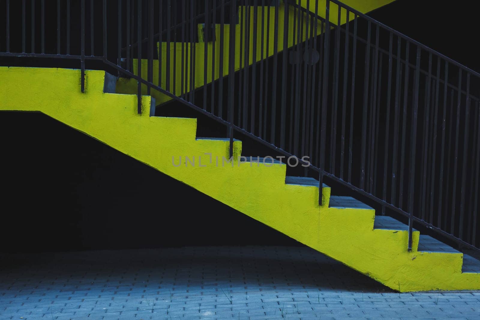 yellow steps in the parking lot. emergency exit