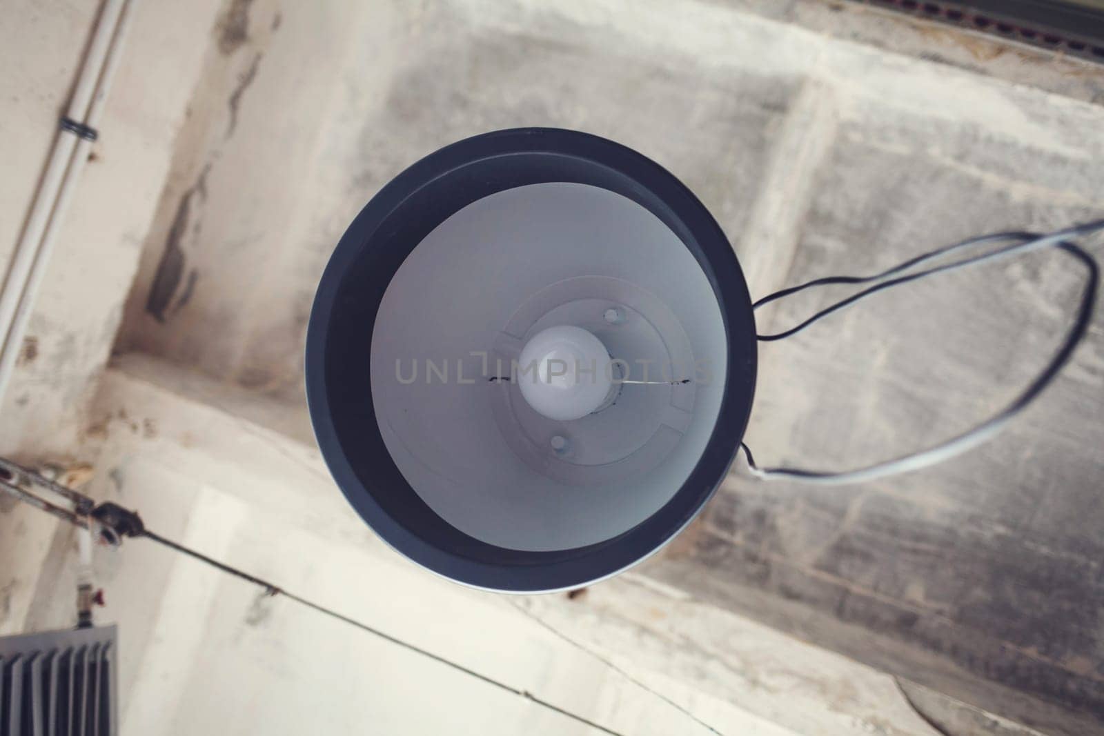 old vintage lamp hanging on the ceiling in the loft