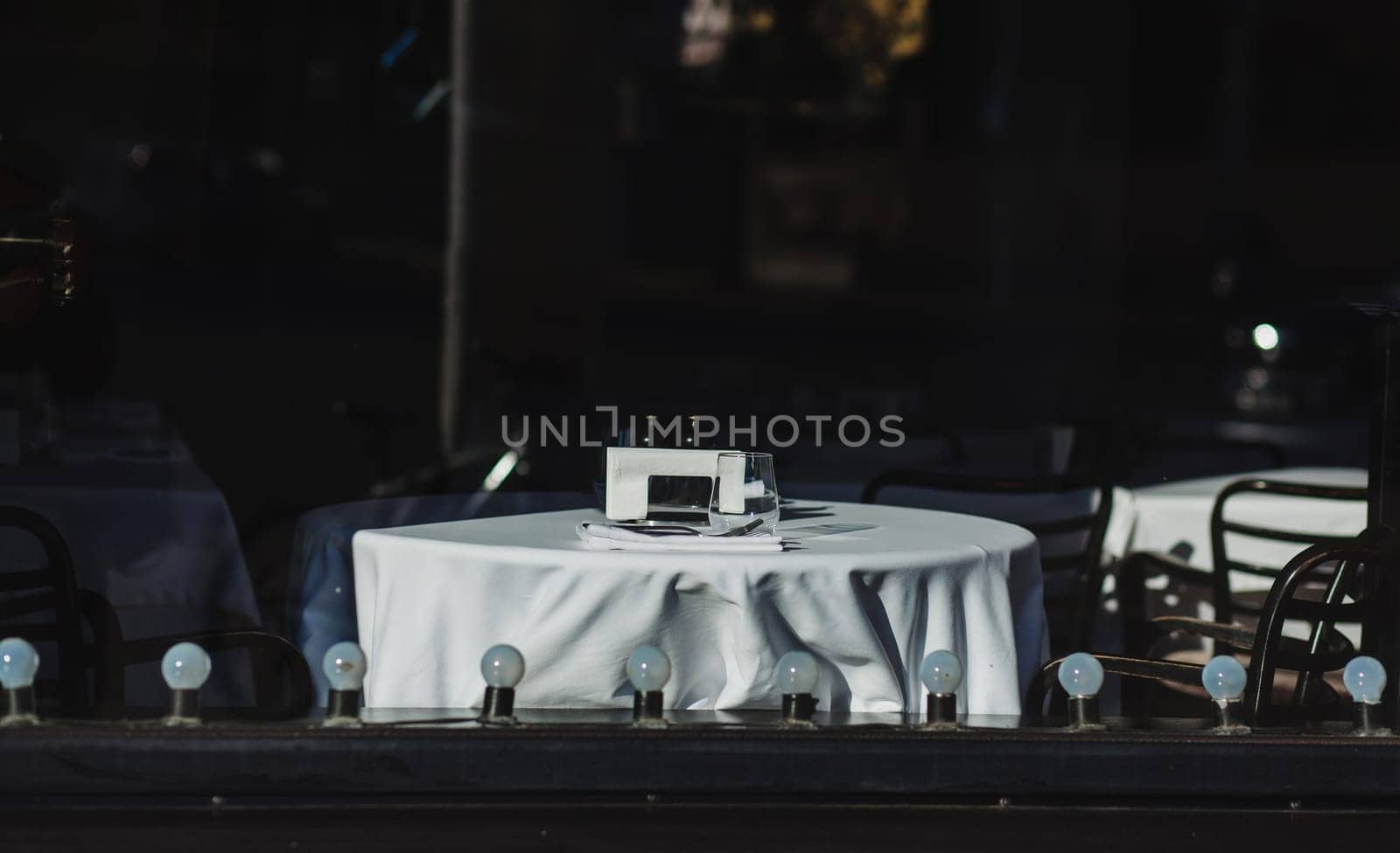 Public restaurant in the city center. cafe window with a table and a white tablecloth