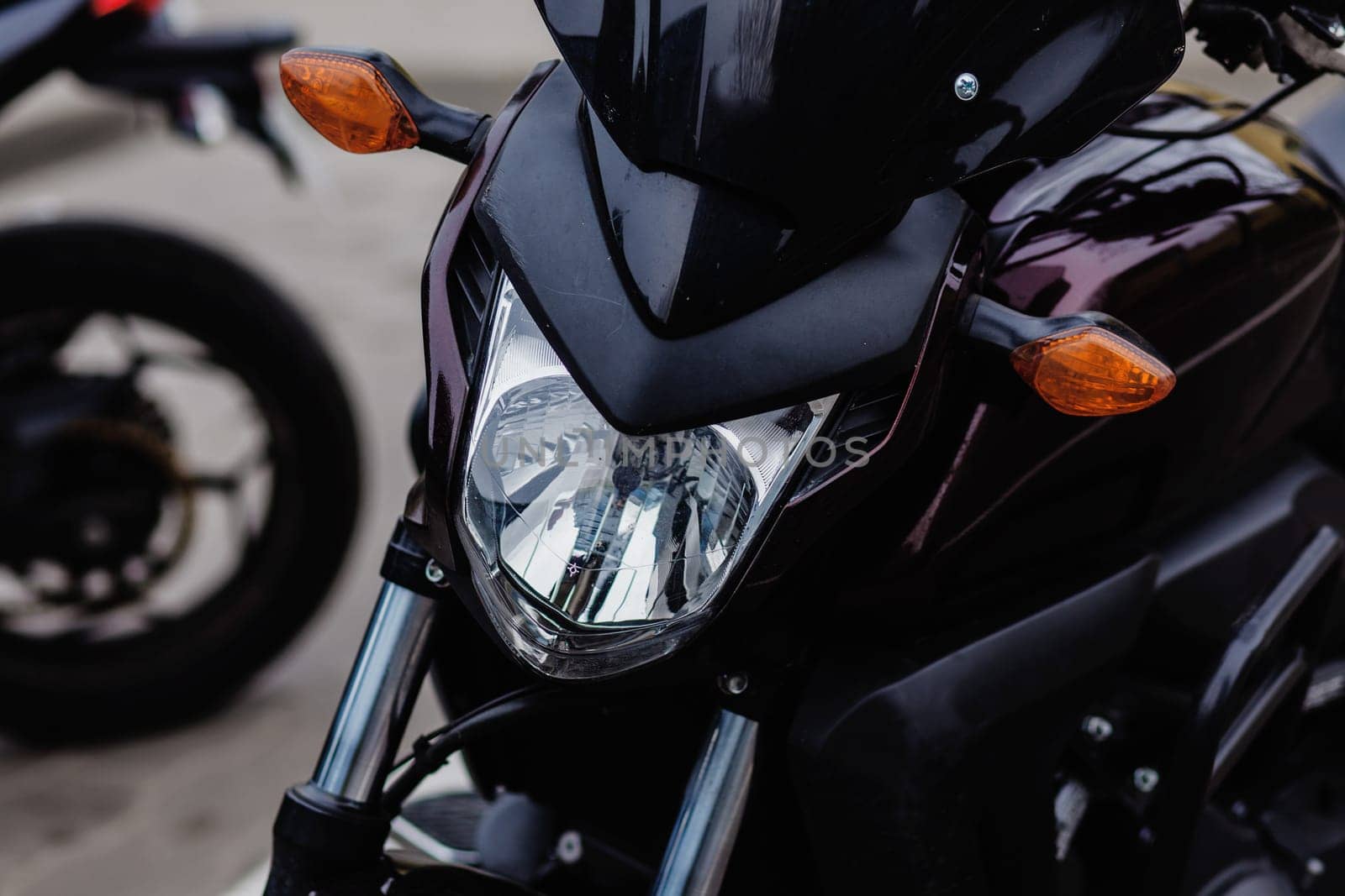 Close up of the front of sport motorcycle. Headlights