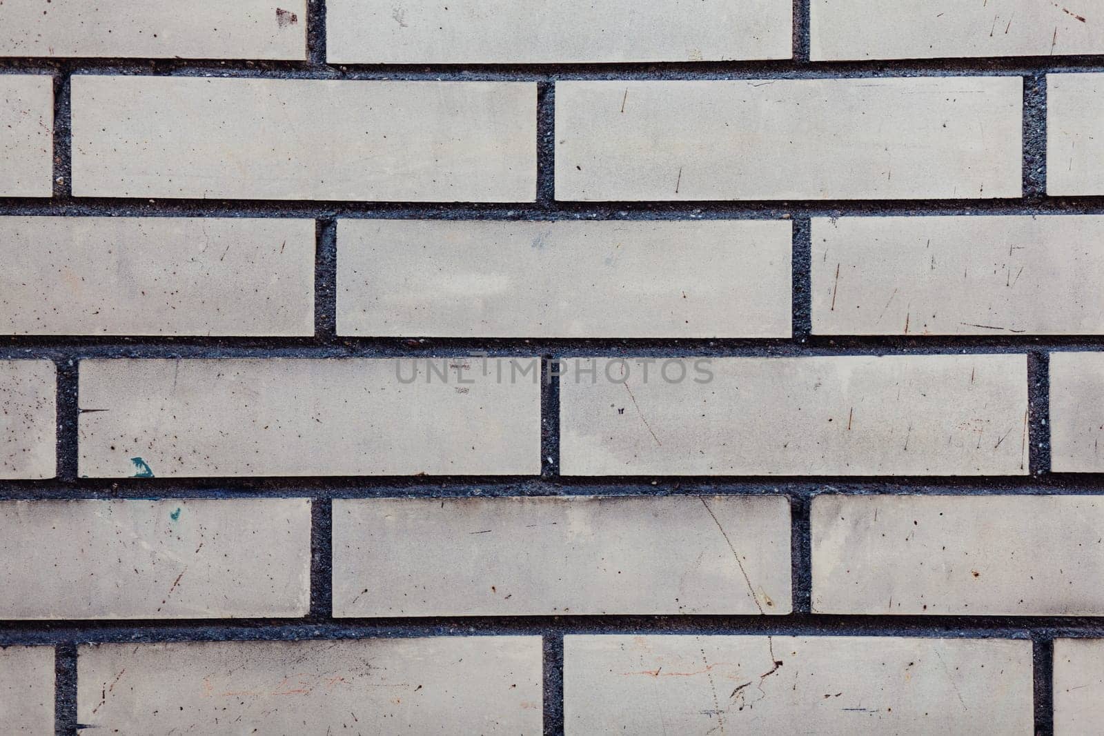 Grey wall background. Old grungy brick wall horizontal texture. 