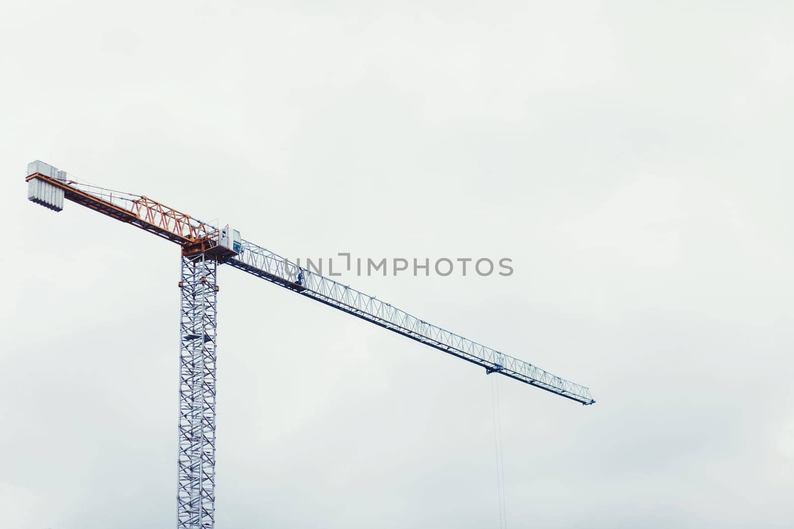 hoisting crane on sky background. construction site