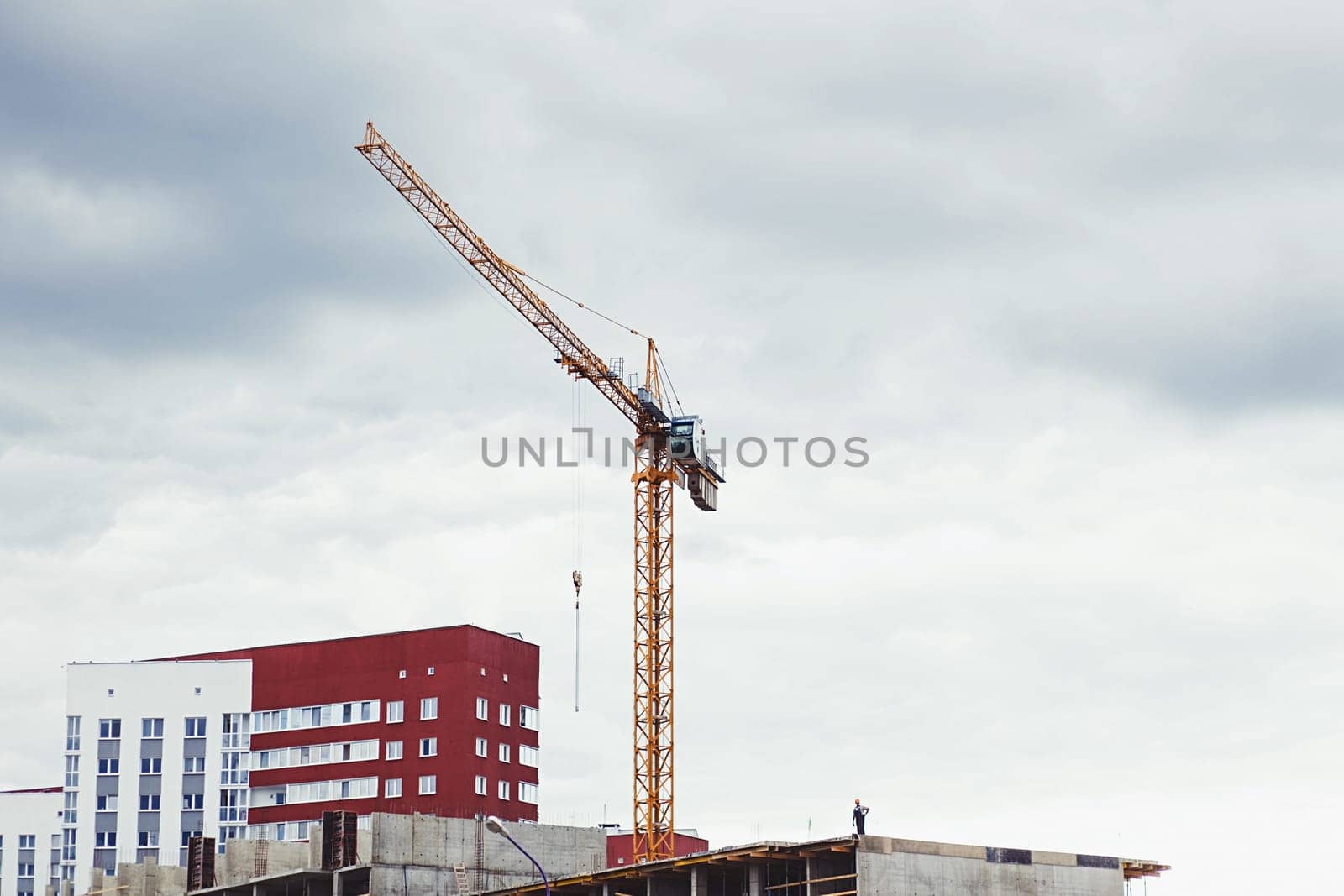 Crane and construction site of the building. new quarter