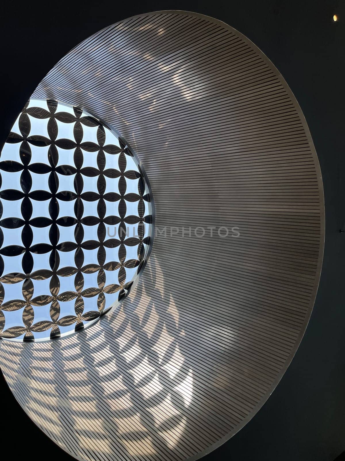 Interesting and unique artistic building roof pattern and texture for backgrounds against blue sky