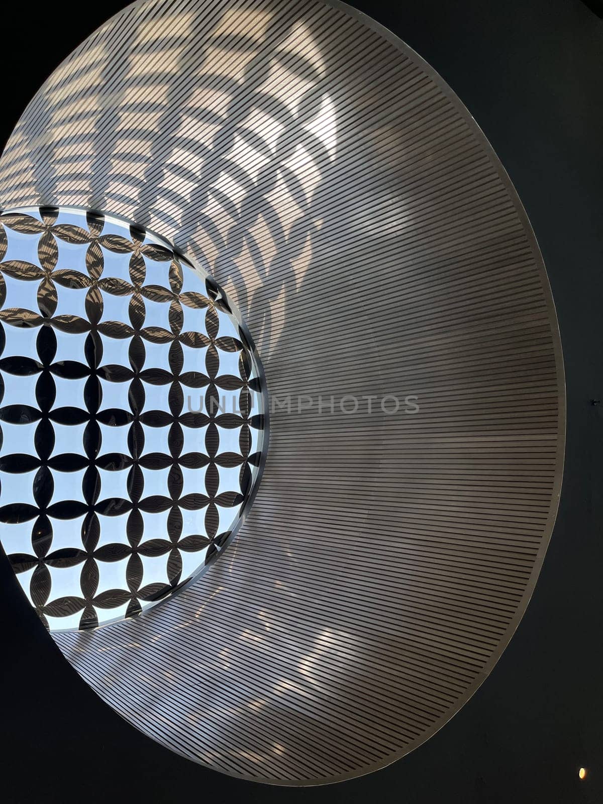 Interesting and unique artistic building roof pattern and texture for backgrounds against blue sky