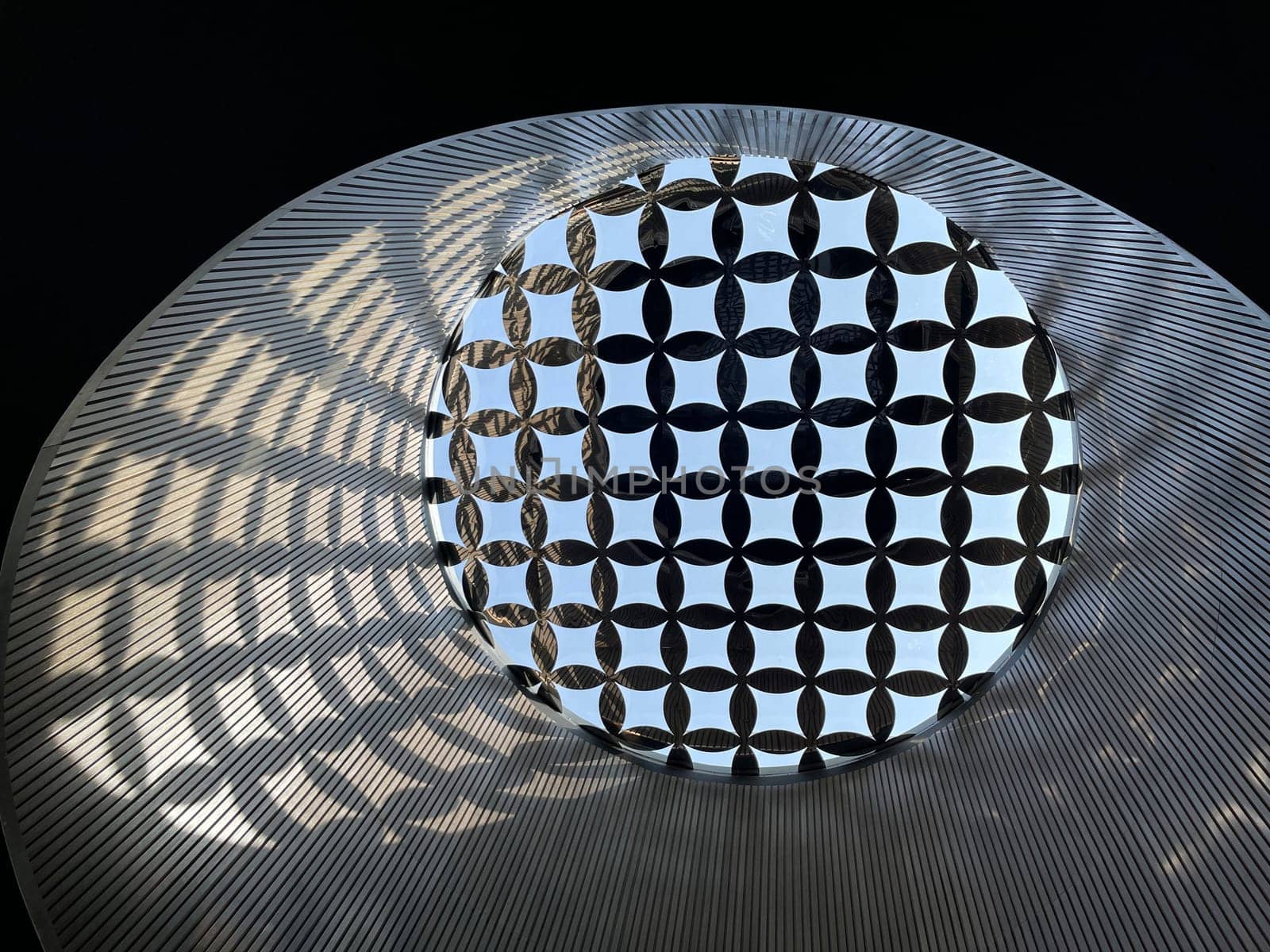 Interesting and unique artistic building roof pattern and texture for backgrounds against blue sky