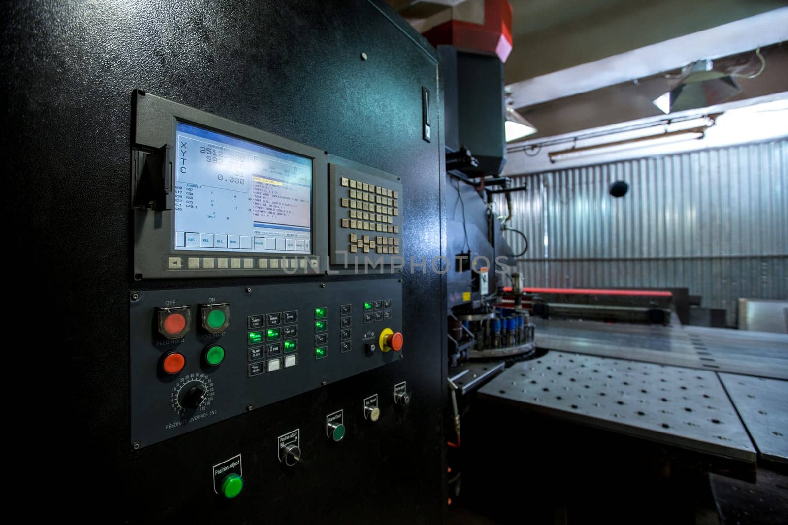 Punching machine. Foreground of monitor and control panel