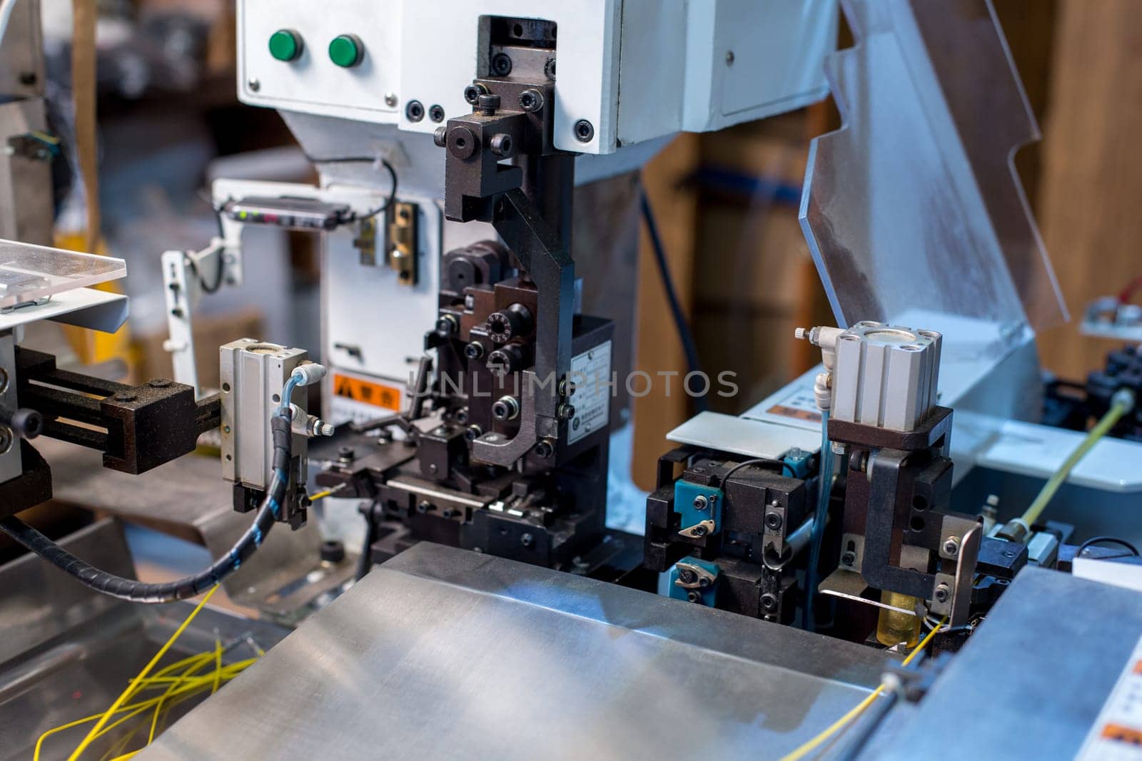 Wires crimp. Image of modern machine at workshop, close-up