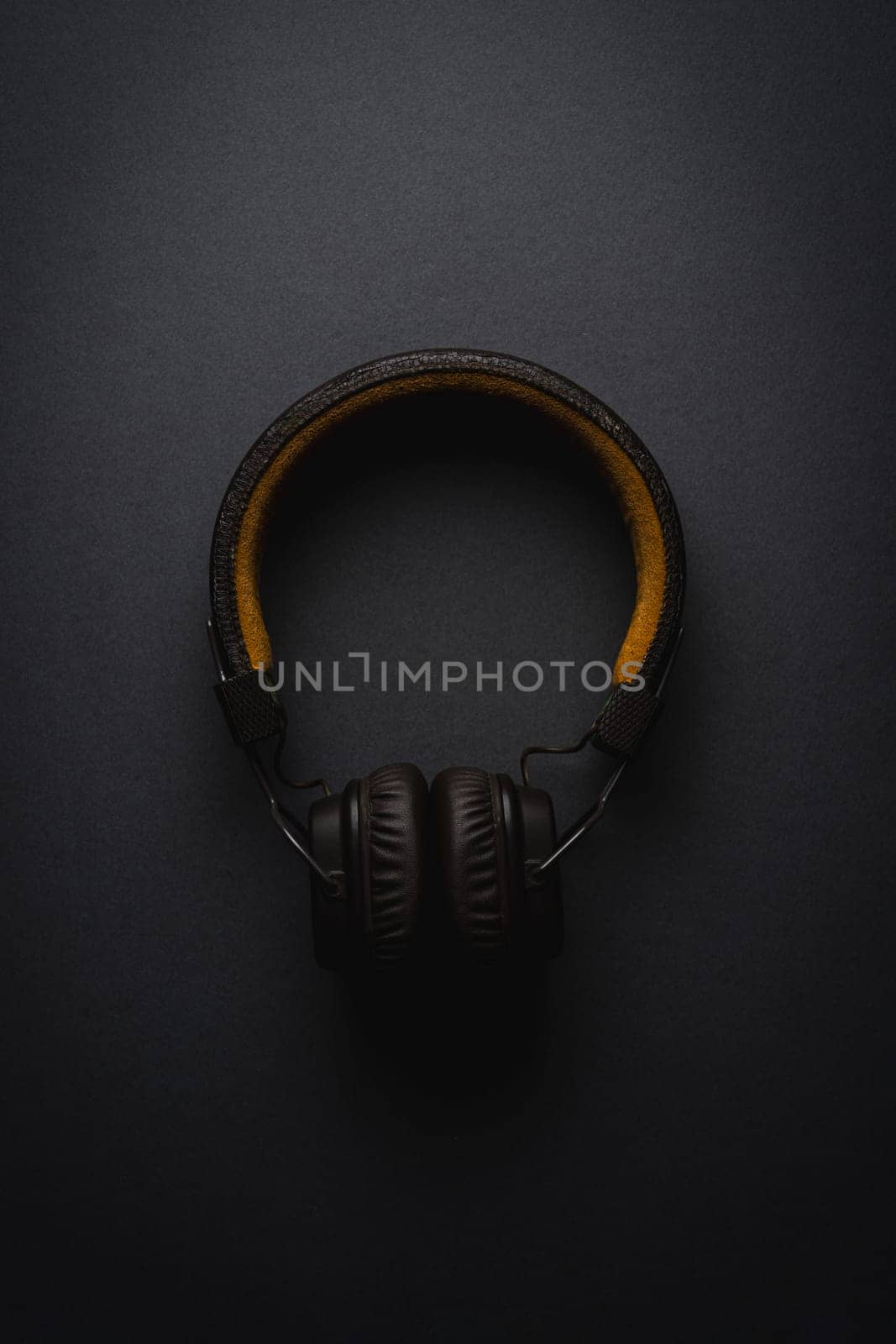 Retro style wireless over-ear headphones on dark gray background