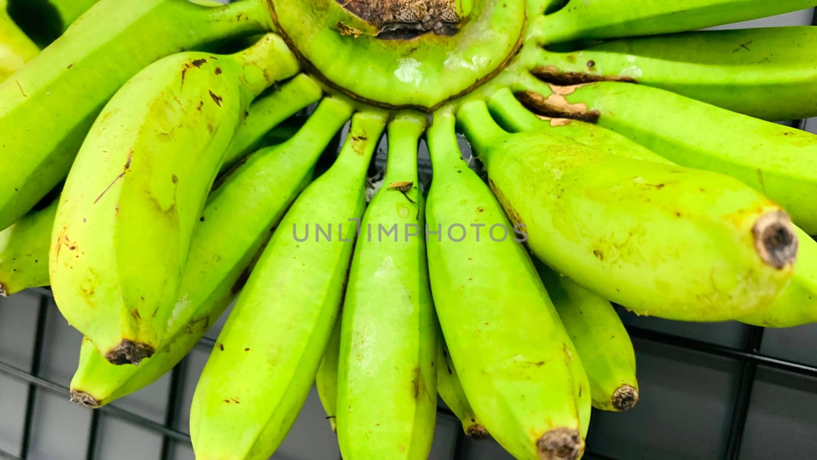 very fresh and ripe delicious banana cluster or banana hand or a bunch of bananas fruit healthy diet supermarket product