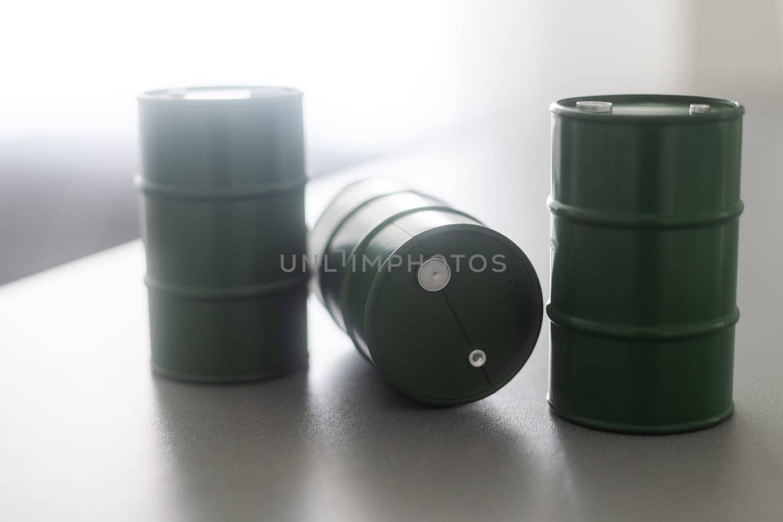 models of barrels with oil on the table.