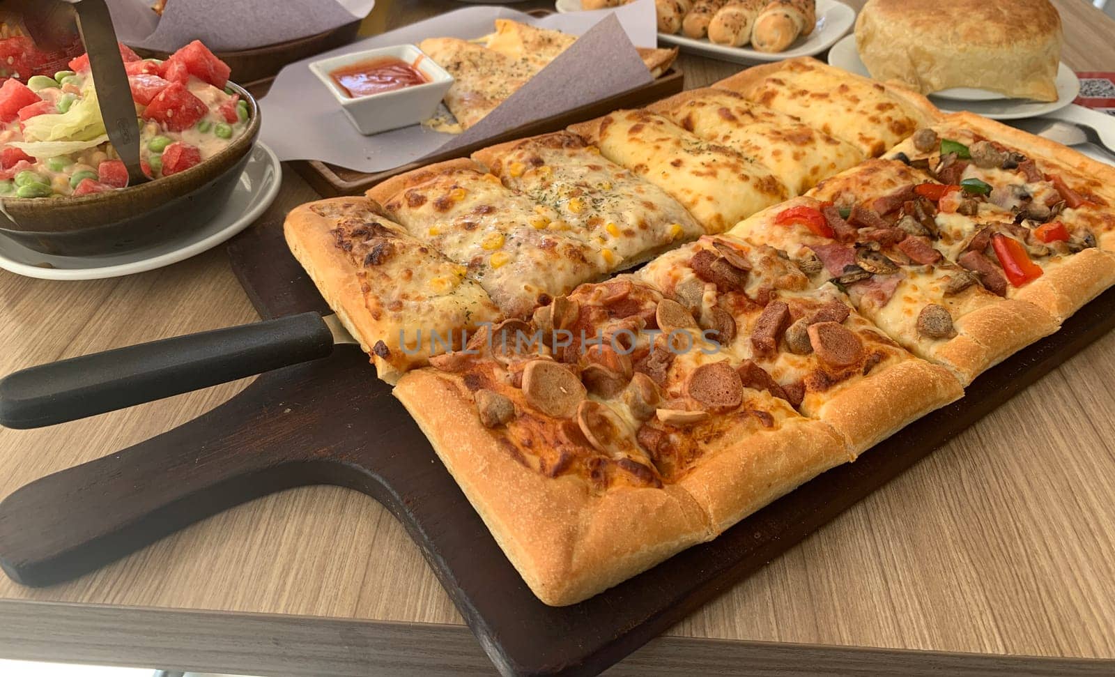 Homemade square pizza with cheese on wooden table Square pizza - Four seasons - Organic pizza - Vegan healthy pizza - Vegetables pizza