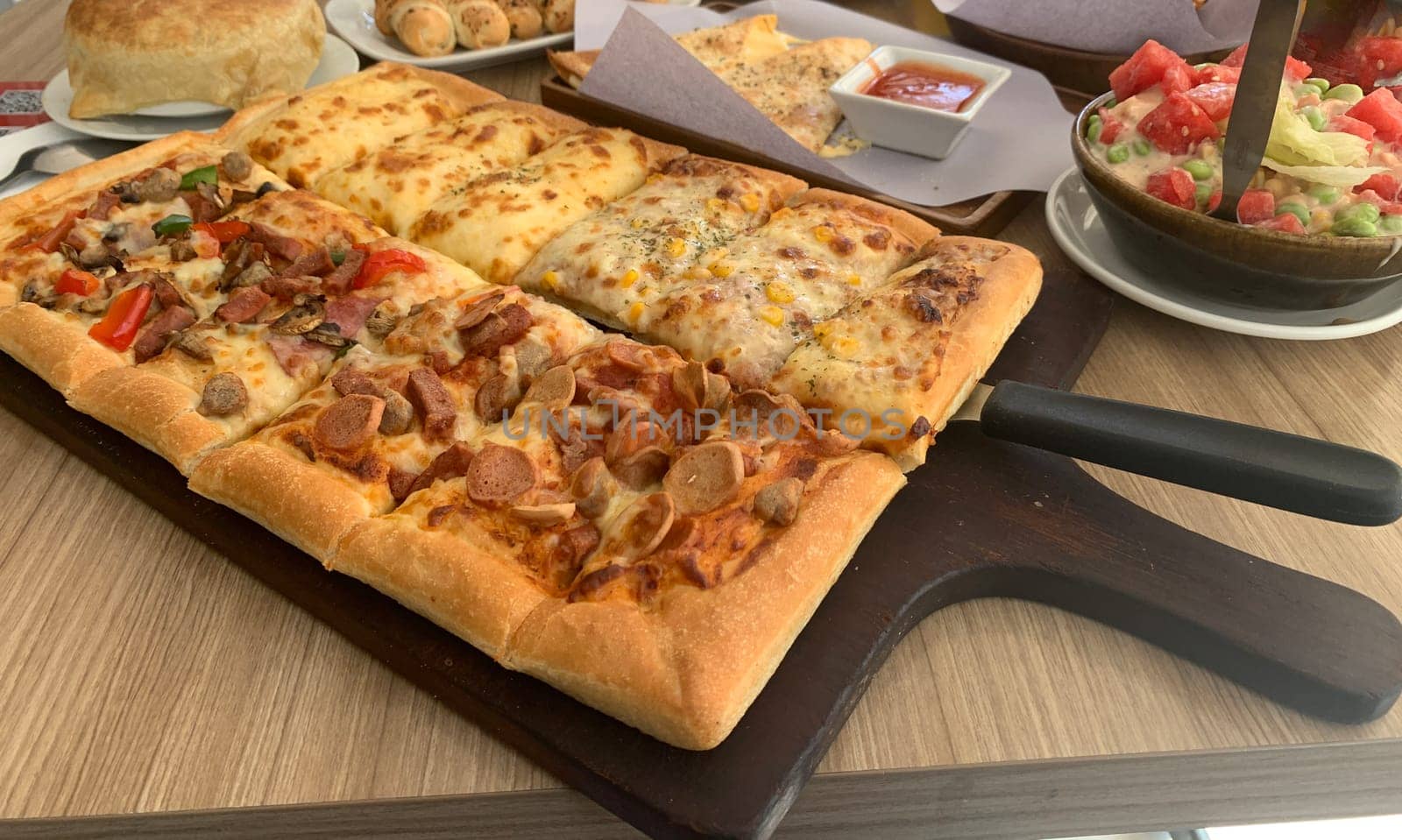 Homemade square pizza with cheese on wooden table Square pizza - Four seasons - Organic pizza - Vegan healthy pizza - Vegetables pizza