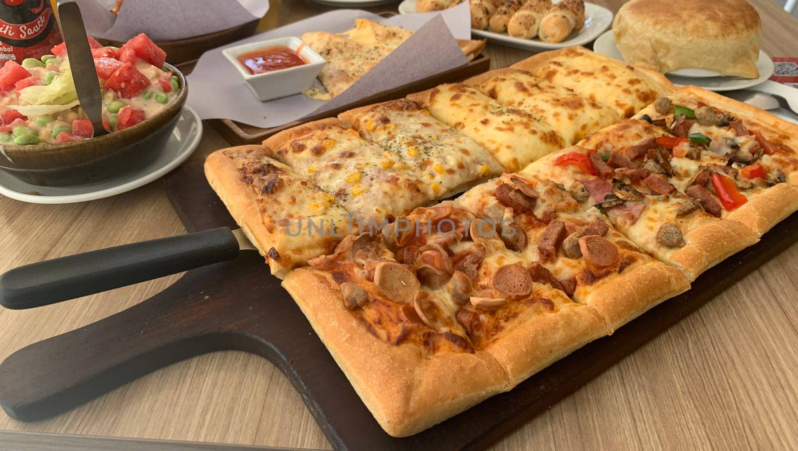 Homemade square pizza with cheese on wooden table Square pizza - Four seasons - Organic pizza - Vegan healthy pizza - Vegetables pizza