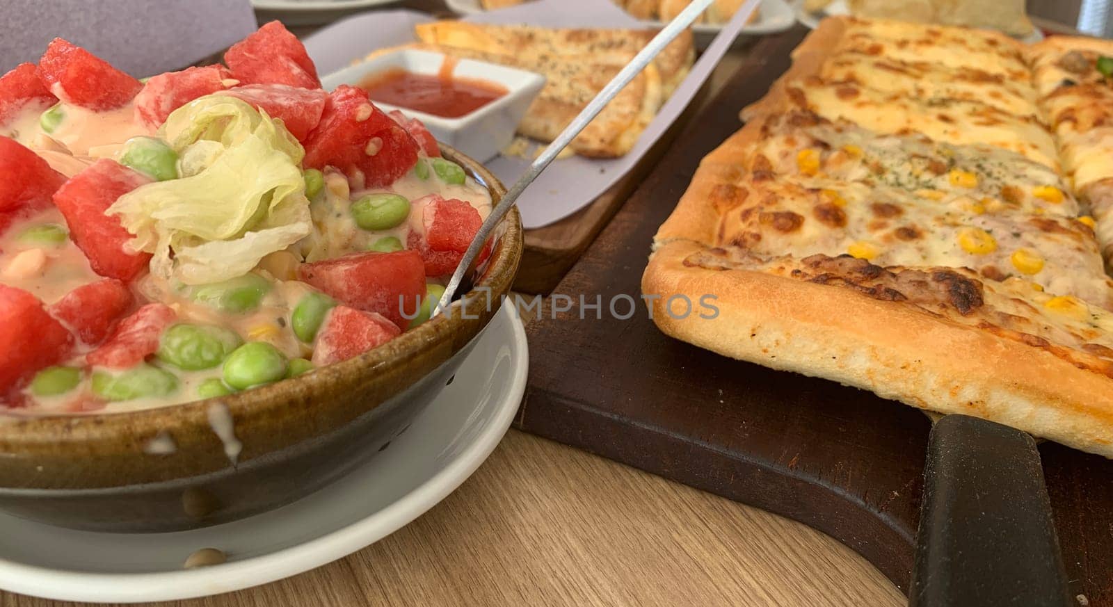 Homemade square pizza with cheese on wooden table Square pizza - Four seasons - Organic pizza - Vegan healthy pizza - Vegetables pizza