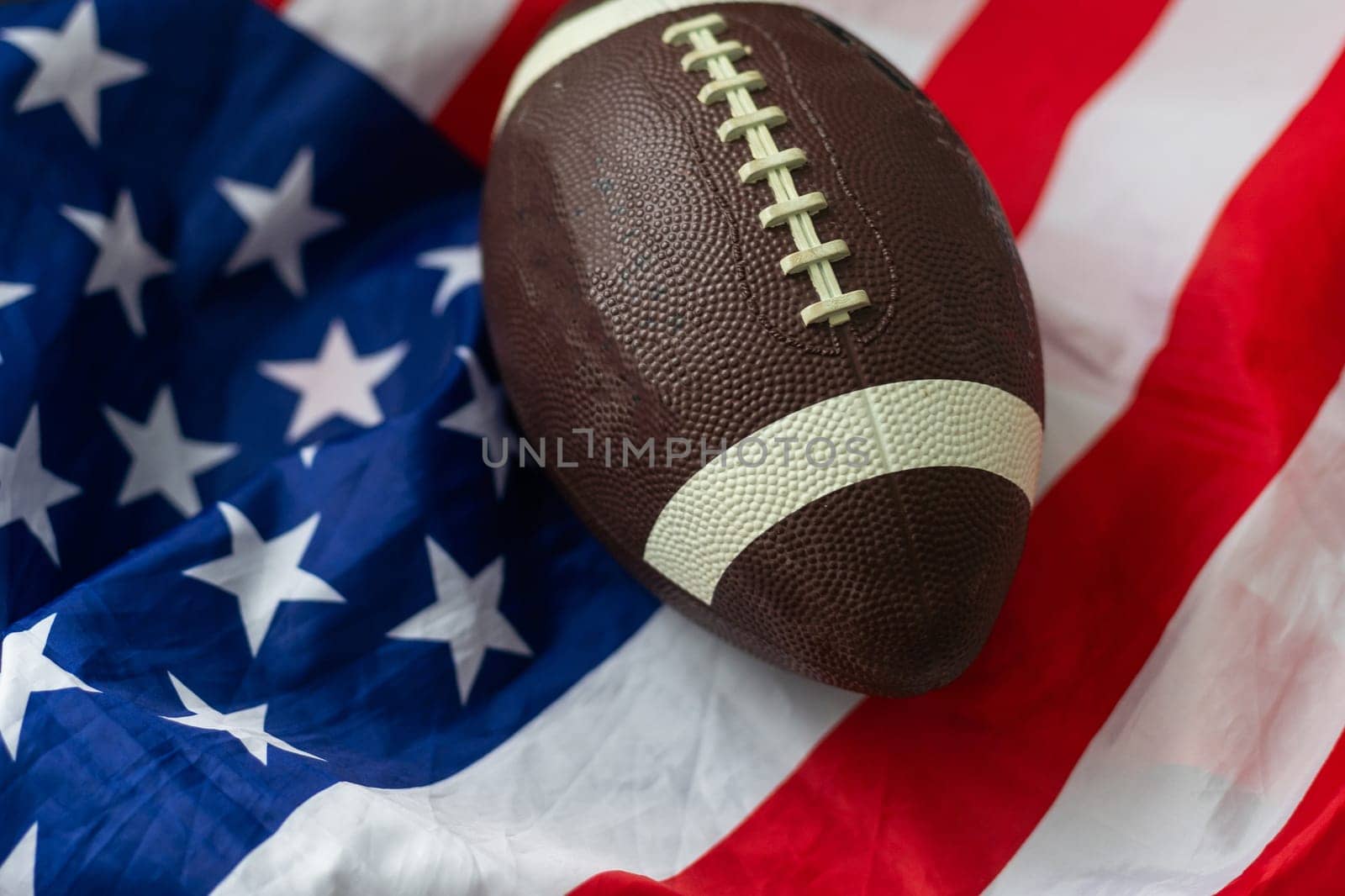 American football ball. American football with American flag. dark background. Team sport concept. copy space. space for text. American football background. America Soccer ball. High quality photo