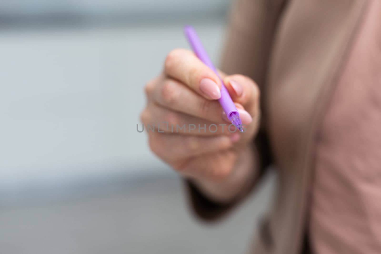 Using a hand hold the pen for writing. High quality photo