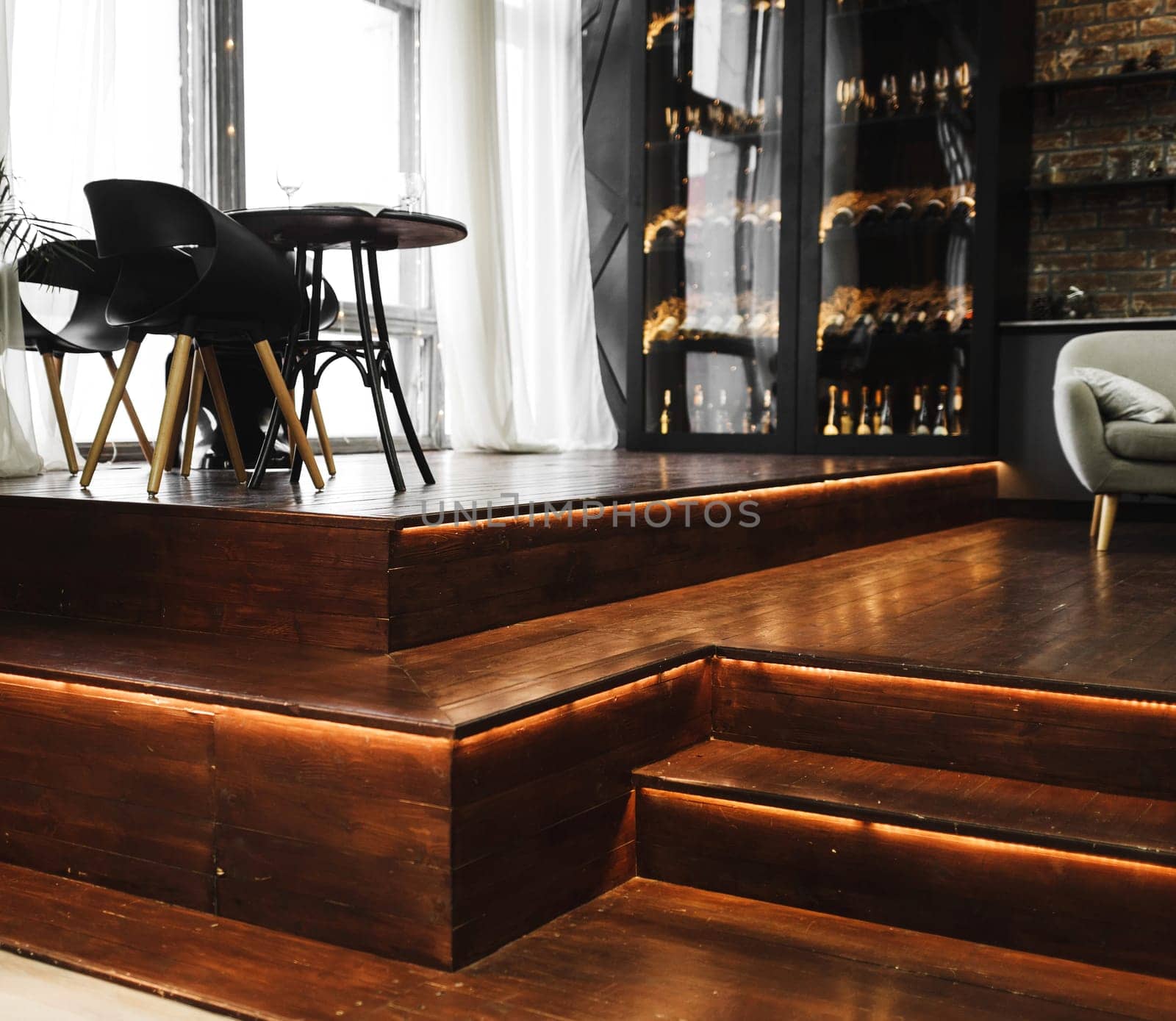 expensive loft style interior with dining area and wine cabinet
