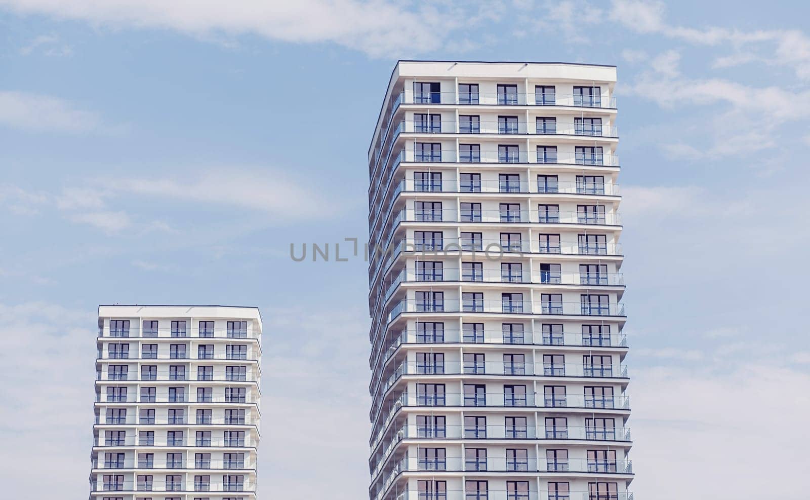 Minsk, Belarus- August 2019: Modern apartment buildings on a sunny day with a blue sky.