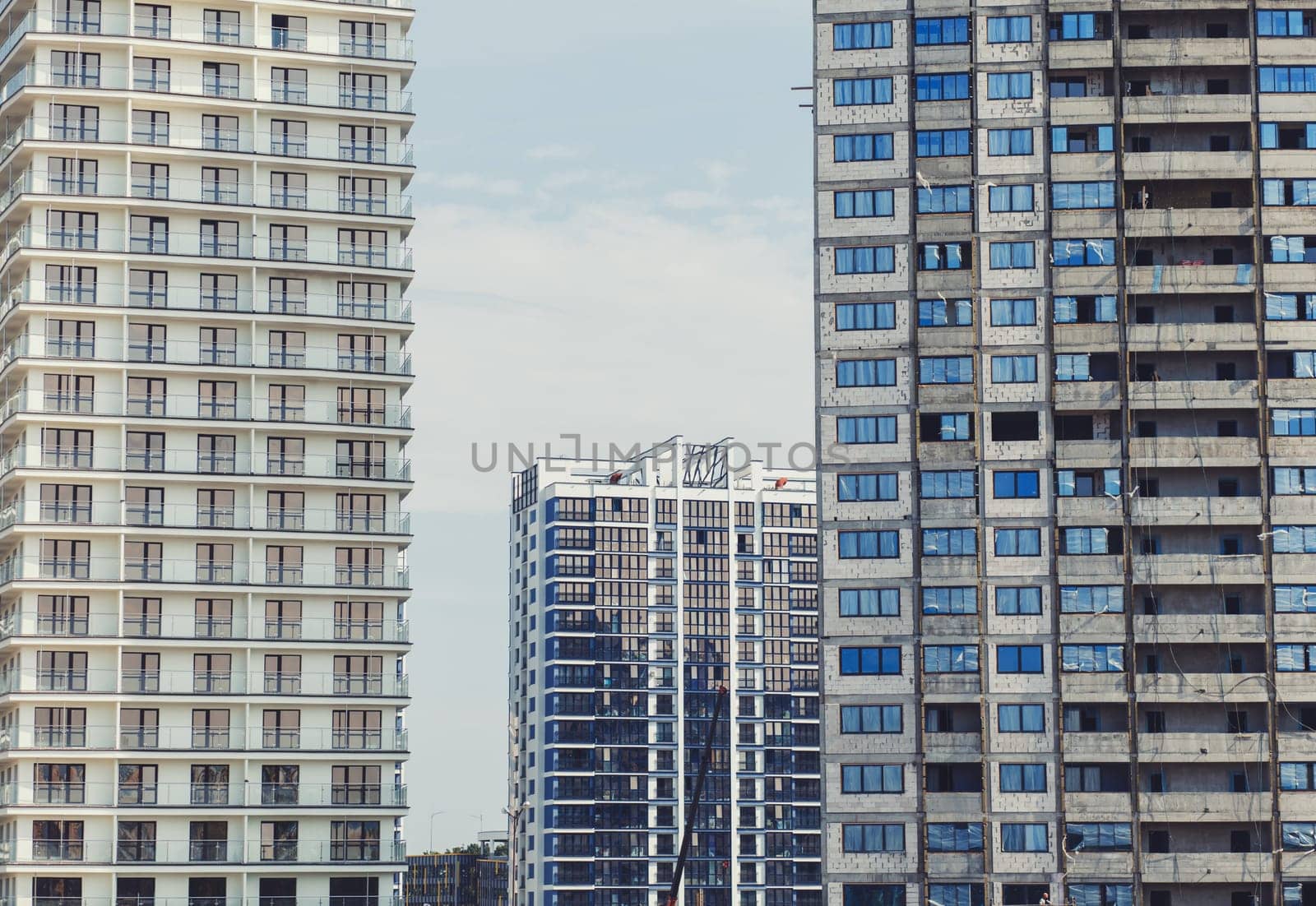 Minsk, Belarus- August 2019: New residential high-rise buildings on the construction site under beautiful summer sky