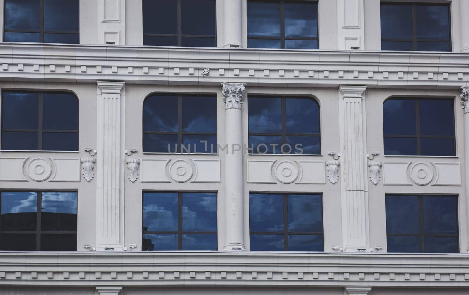 Vintage facade classical building. Columns, stucco and other architectural decoration of the Baroque style 