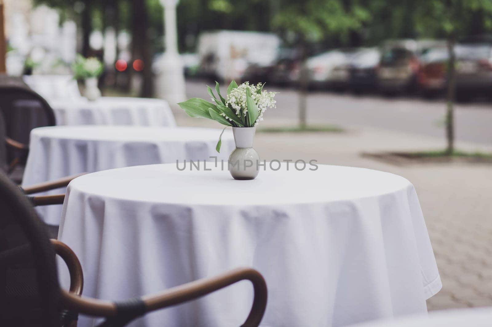 Charming traditional french cafe with tables on terrace 