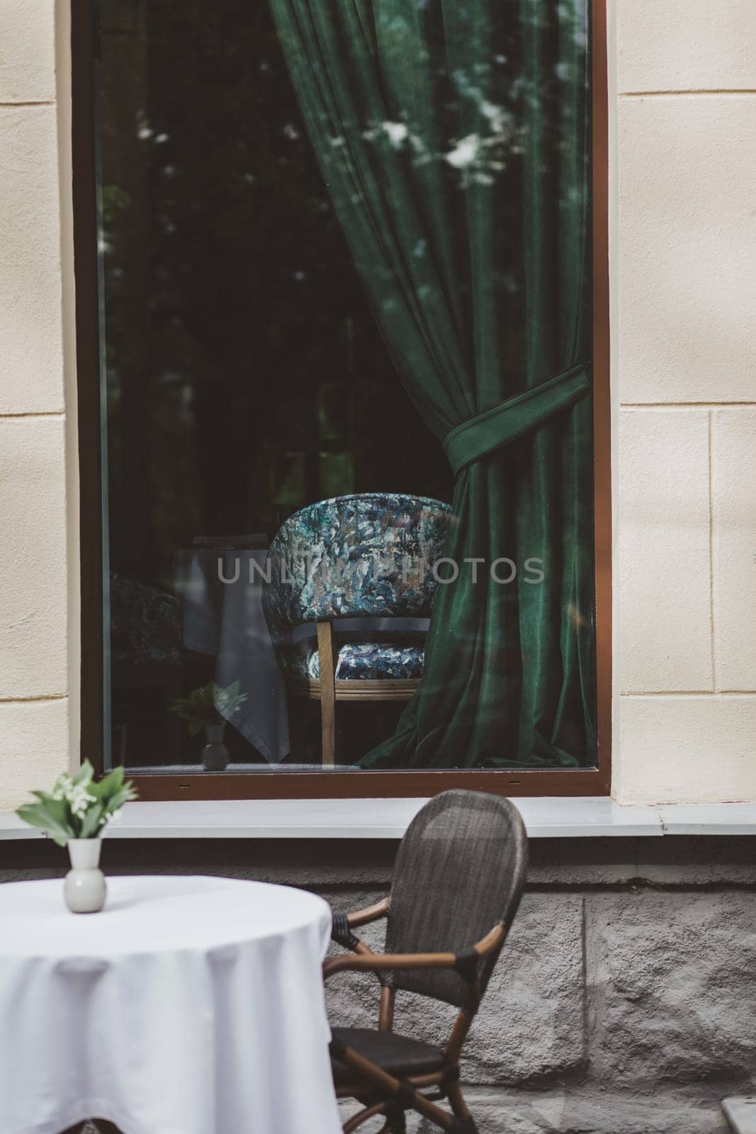 View of empty table in outdoor cafe on european street