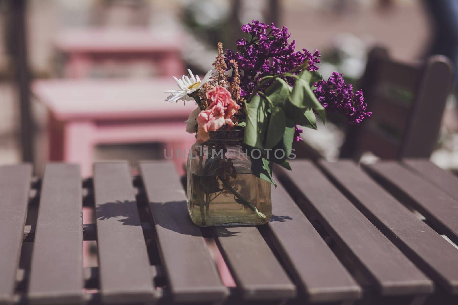 Tables of a european outdoor cafe decorated
