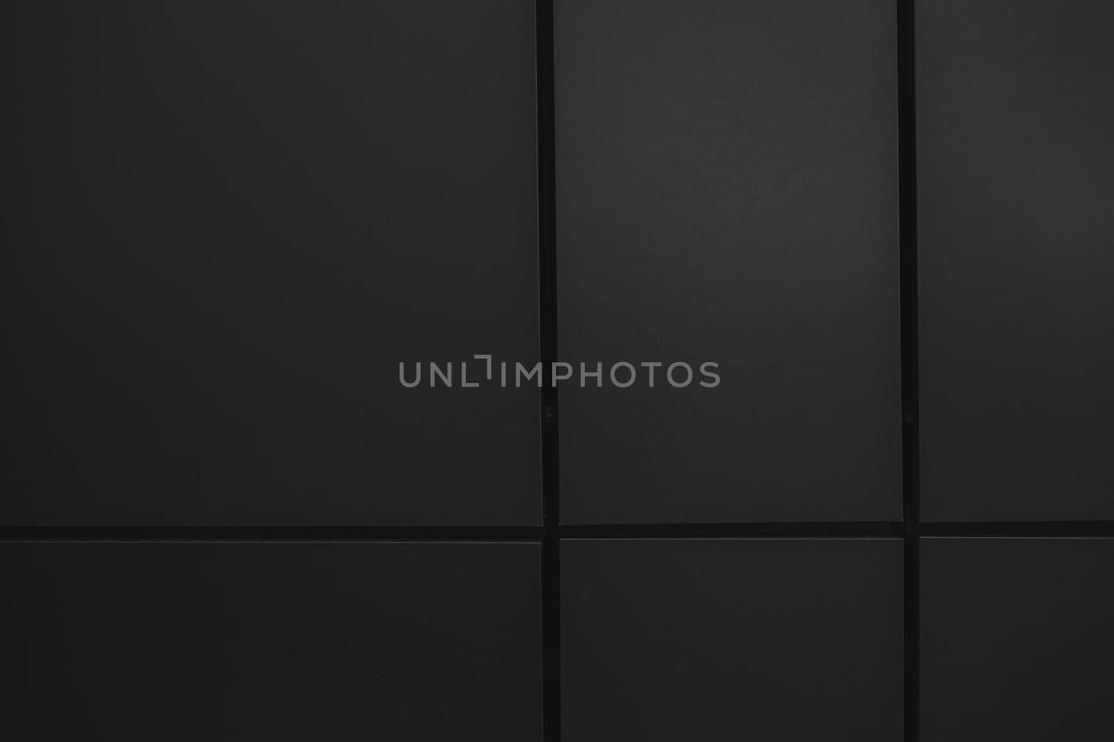 Metal wall tiles, wall detail a facade in the city, modern construction. black and white
