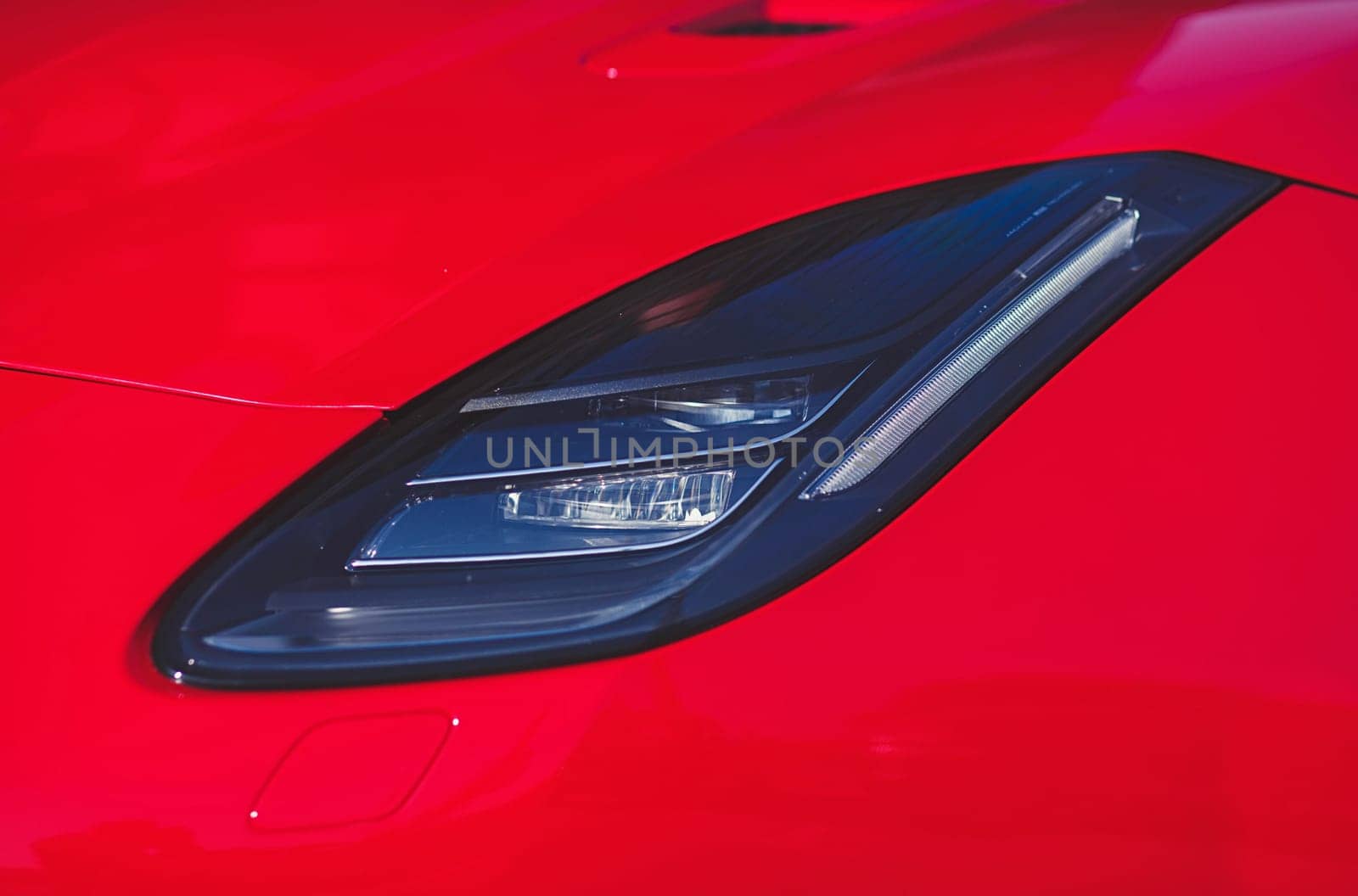 Car headlight. red color auto