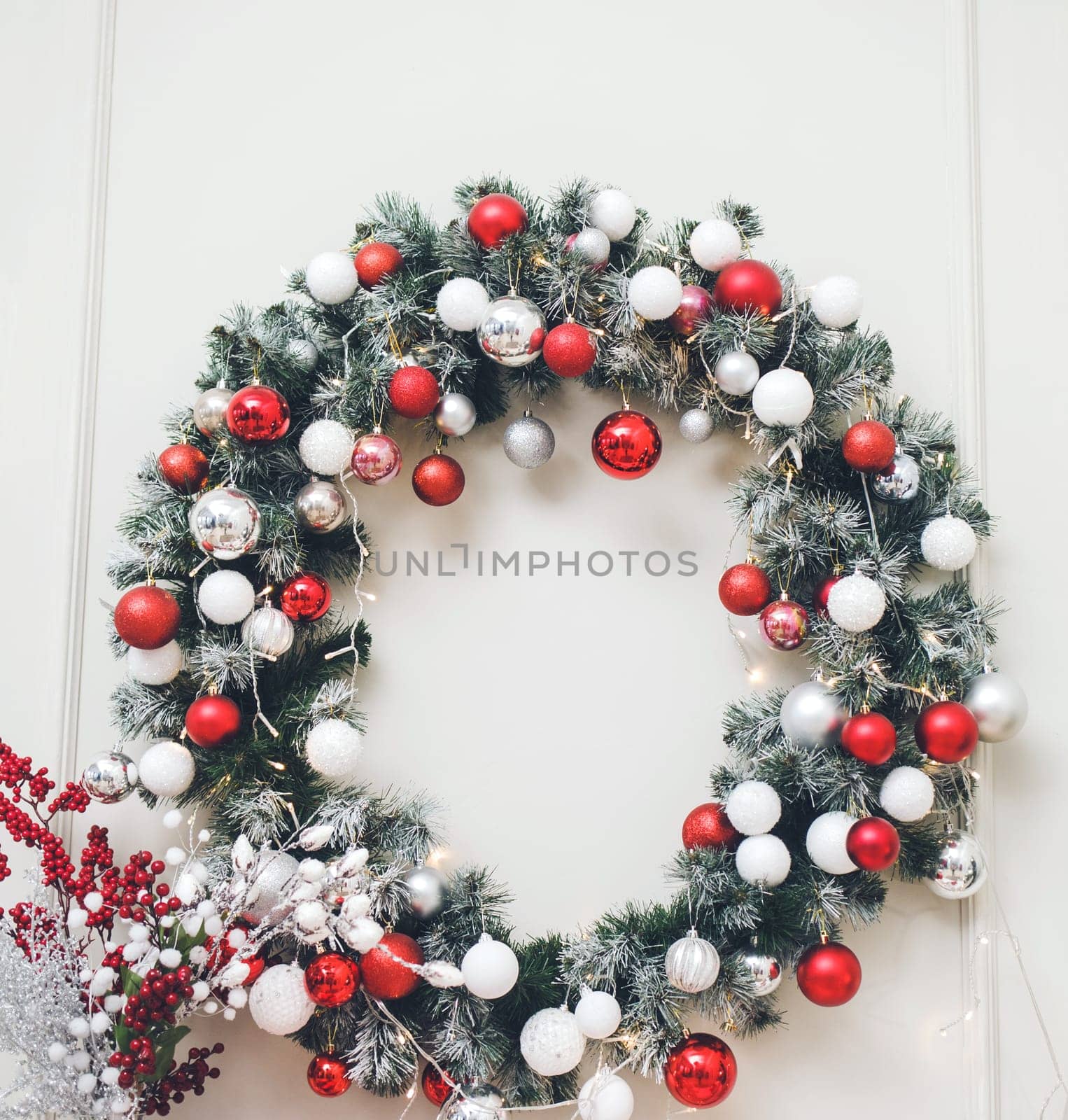 Christmas wreath with balls on the wall in the living room. new year concept
