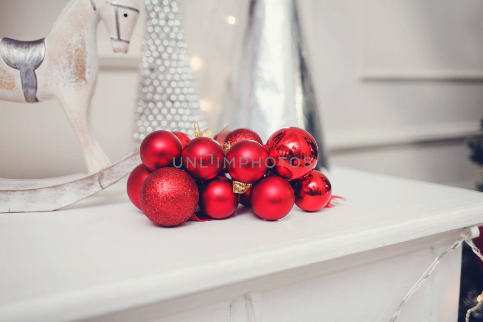 red Christmas balls are on the shelf
