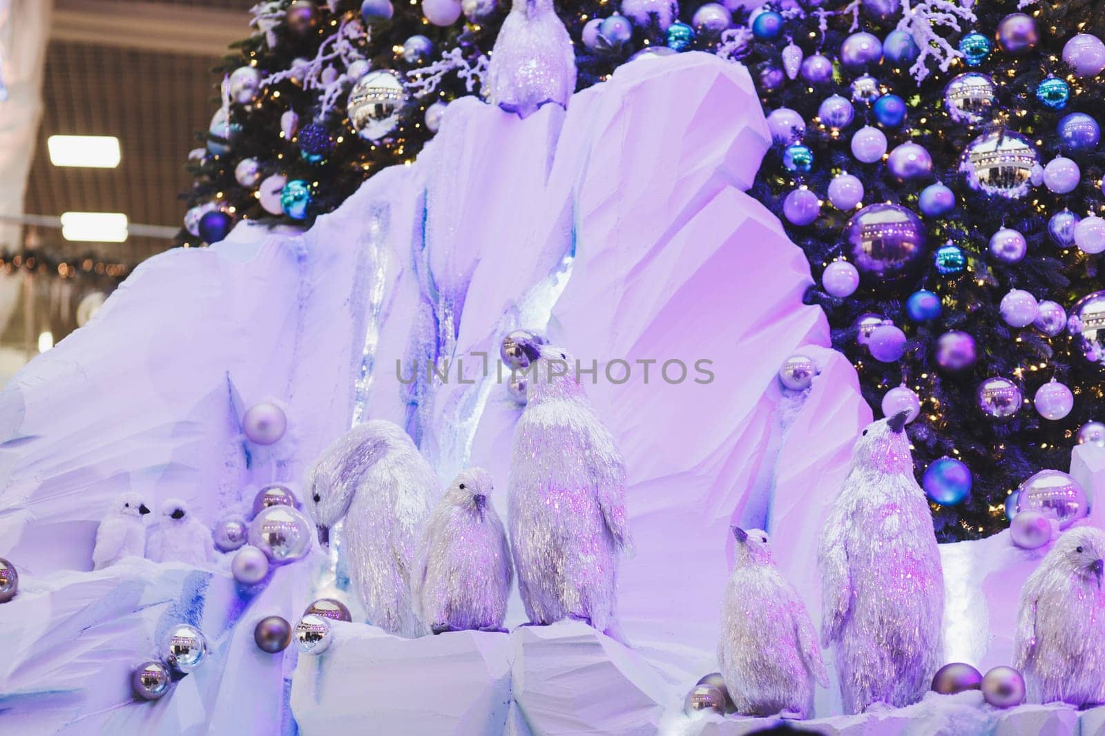 beautiful Christmas tree with toy penguins in the Mall