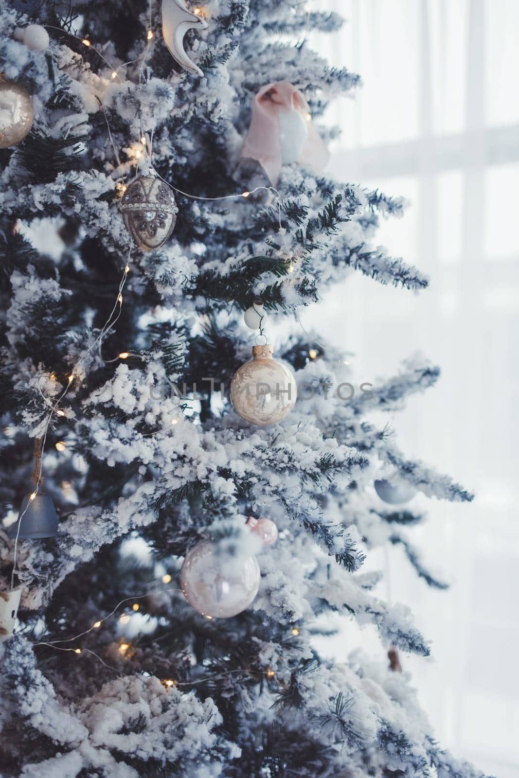 Decorations on christmas tree at morning, soft focus 