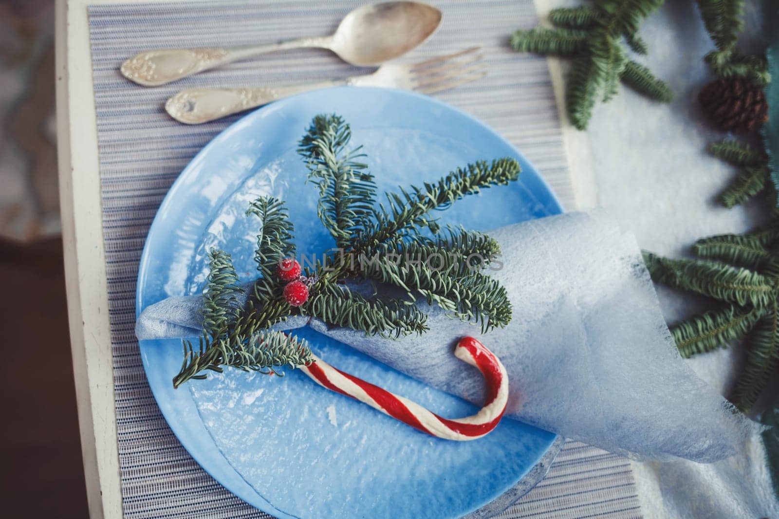 Christmas table setting with vintage dishware. Top view. 