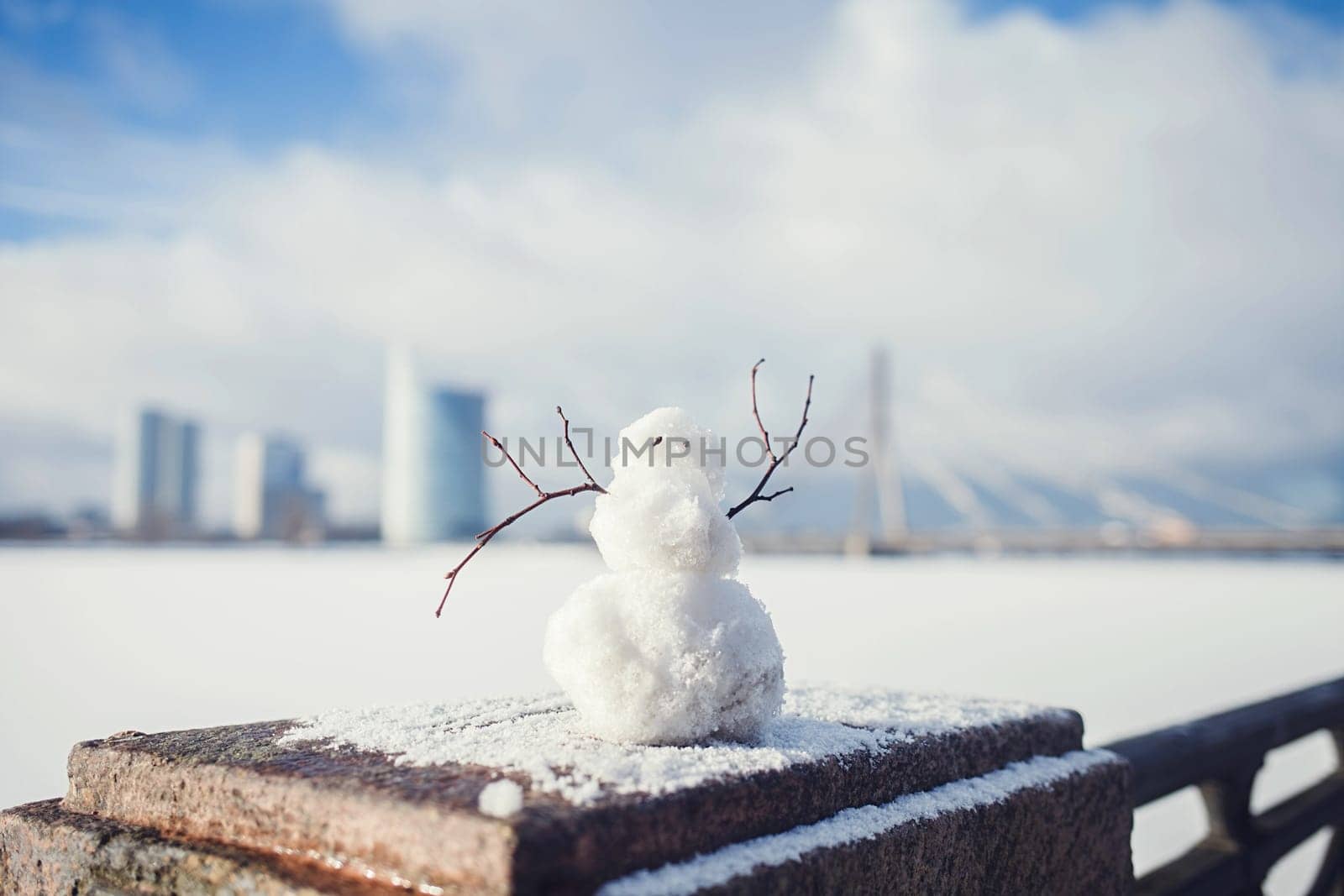 snowman on the background of the winter landscape of Riga, Latvia