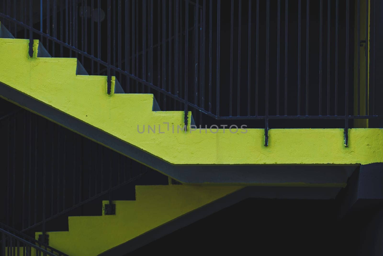 yellow concrete stairs in an urban environment